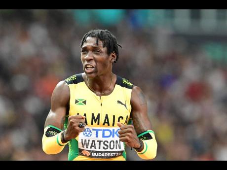 Jamaica’s Antonio Watson celebrates winning the men’s  400 metres title at the World Championships in Budapest, Hungary, on Friday. Watson clocked 44.22 seconds.