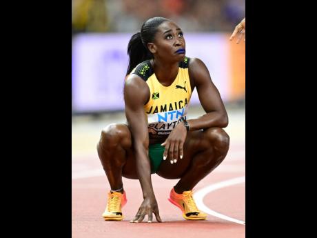 Jamaica’s Rushell Clayton watches the replay in the stadium after winning bronze in the women’s 400 metres hurdles at the World Championships in Budapest, Hungary, on Friday.