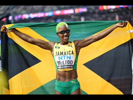 Candice McLeod celebrates after Jamaica’s silver medal in the women’s 4x400 metres relay at the World Athletics Championships yesterday in Budapest, Hungary.