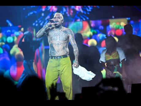 Credit: Ricardo Makyn International recording artiste Chris Brown in performance at the National Stadium early Monday morning.