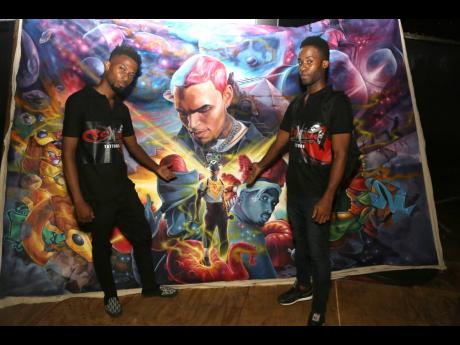 Credit: Nathaniel Stewart Romar Wilmot (left) and Jason Hall show their masterpiece.