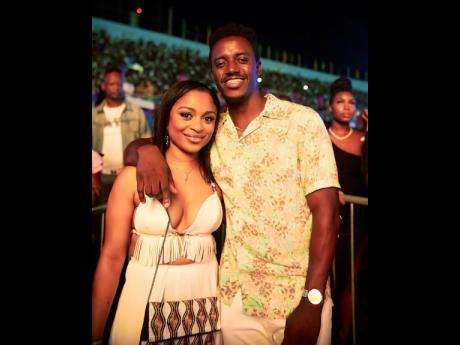 Romain Virgo and wife, Elizabeth, smile for the camera.