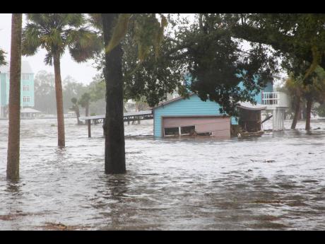 Storm surge floods a home off Riverside Drive on the Steinhatchee River in  Florida. Hurricane Idalia made landfall on Wednesday in Florida as a Category 3 storm and unleashed devastation along a wide stretch of the Gulf Coast, submerging homes and vehicles, turning streets into rivers, unmooring small boats and downing power lines before sweeping into Georgia.
