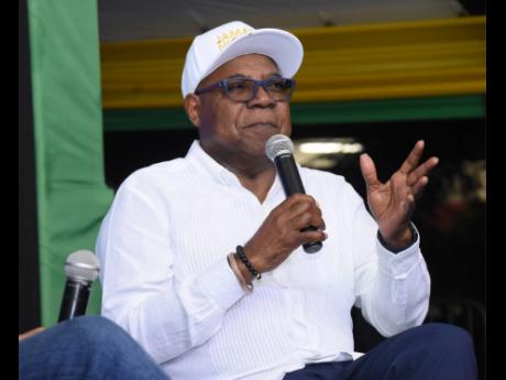 Credit: Ashley Anguin Minister of Tourism Edmund Bartlett addressing a town hall meeting at the Harmony Beach Park in Montego Bay, St James, last Thursday.