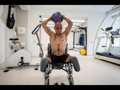 Hennadiy Techyna, a Ukrainian servicemen from the international legion, exercises at the Superhumans rehabilitation centre in Vynnyky, Ukraine, on July 20. Ukraine is facing the prospect of a future with upwards of 20,000 amputees, many of them soldiers who are also suffering psychological trauma from their time at the front. 