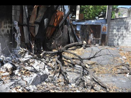 Credit: Nicholas Nunes/Photographer Nothing but rubble remains from some sections of Rum Lane that were affected by the arson attack.