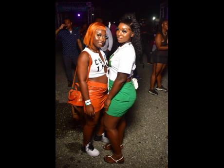 Natasha Daley (left) and Stacy-Ann Williams hang out at Streetz Festival, featuring Masicka, at the National Stadium in St Andrew last Saturday.