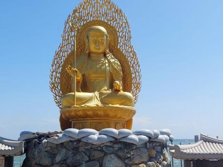The Buddha idol at the Haedong  Younggung Temple is a major attraction for many tourists.