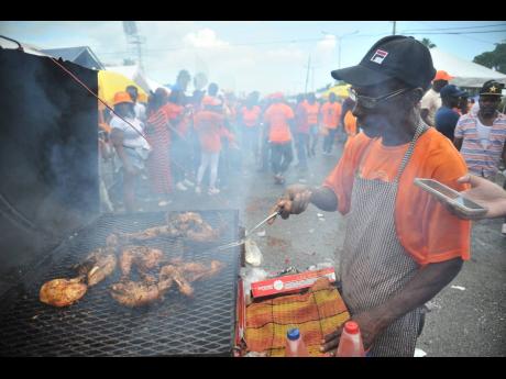 Jerk chicken vendor Delroy Blair said it was a good day for business at yesterday’s annual conference of the People’s National Party.
