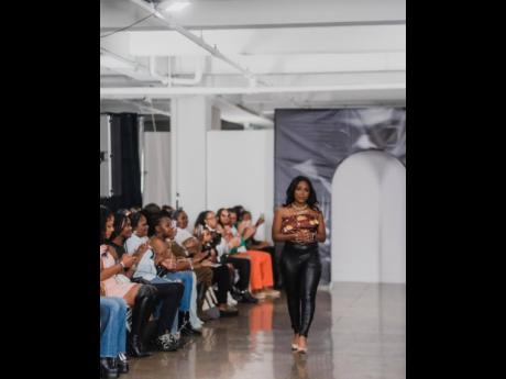 Credit: Contributed Thompson walks the runway after showcasing her pieces.