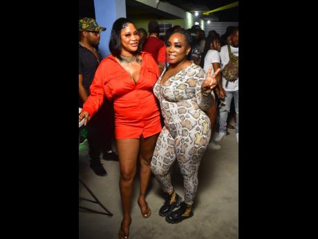 Credit: Anthony Minott Donnalee (left) hangs with Atena at Tall Boss’ birthday celebration held at Di Legendary Bar & Grill, located on Port Henderson Road, recently.