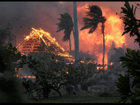 The hall of historic Waiola Church in Lahaina and nearby Lahaina Hongwanji Mission are engulfed in flames.