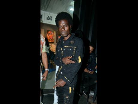 Dancehall artiste Blackman attended the launch in a  full suit of black.