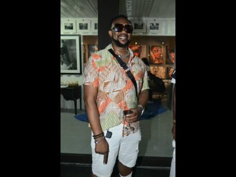 Shaka Pow kept it simple in a Daniel K shirt and Gucci shades.