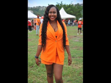 Credit: Nicholas Nunes/Photographer Renay Robinson, chairman of the People’s National Party Youth Organisation, rocks her orange outfit at her party’s 85th annual conference held recently at the National Arena in St Andrew.