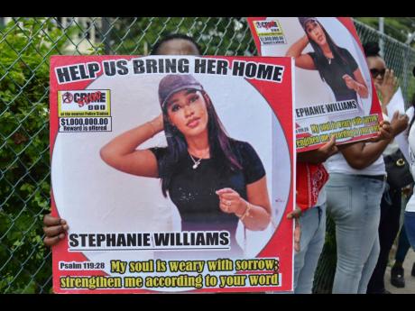 Credit: Kenyon Hemans Family and friends of Medikk staged a protest outside the Constant Spring Police Station on September 26, seeking help from the public to find their loved one.