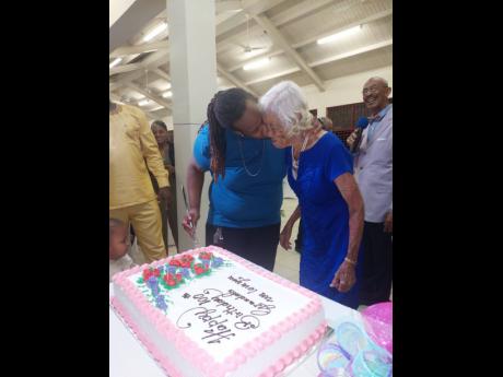 Credit: Andre Williams Robinson’s great-grandson Stewart Bryan gives her a ‘chups’ at her 100th birthday party.