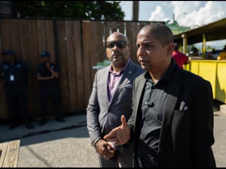 Kingston's Mayor Delroy Williams (right) and CEO of the Kingston and St Andrew Municipal Corporation Robert Hill.