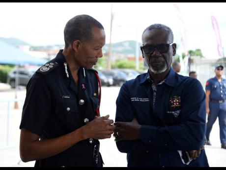 Credit: Kenyon Hemans Photos by Kenyon Hemans/Photographer
Commissioner of the Jamaica Fire Brigade Stewart Beckford (left) speaking with Desmond McKenzie, minister of local government and community development, during yesterday’s media launch of the brigade’s Fire and Life Safety Awareness Week 2023.