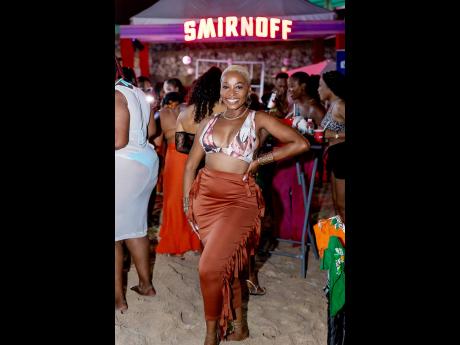 Credit: Contributed Singer Clara ‘CK’ Kahwa slayed in a chocolate skirt and printed bikini top.