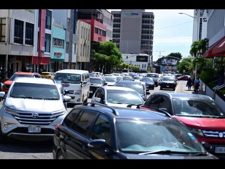 Traffic piled up in New Kingston following the earthquake as several businesses closed early.