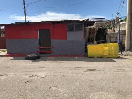 The shop on Delano Avenue off Hagley Park Road, St Andrew in which three persons, including a six-year-old were shot. The child, Arianna Salmon, died at hospital.