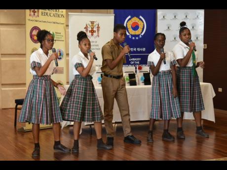 Students from Oberlin High School perform at the handover of 4,103 tablet computers by the Republic of Korea, valued at more than $92 million, at a ceremony held at the offices of the Ministry of Foreign Affairs and Foreign Trade in downtown Kingston on Tuesday.

 