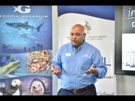 Credit: Nicholas Nunes/Photographer Director of Global Ocean Policy at Georgia Aquarium, Dr Dayne Buddo speaking at the Shark Education Workshop at the AC Hotel, Lady Musgrave Road, St Andrew on Tuesday.