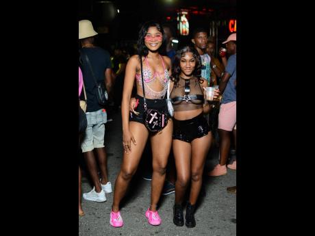 Girlfriends Toriann Duffus (left) and Latori Clarke came decked out and ready in true soca attire.