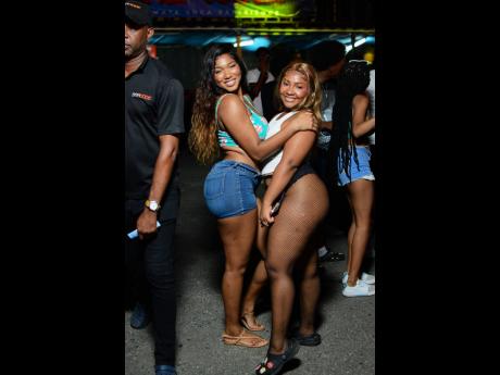 Crystal Harvey (left) and Tressann Lyew did not shy away from striking a pose for our lens at the Campari-sponsored event.