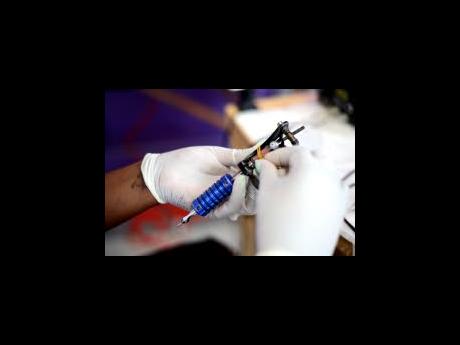 Credit: File Tattoo artist have reported a consistent line of persons who come to him for the names and initials of their partners.