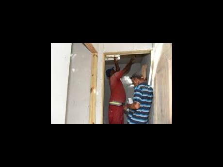 Workmen constructing restroom facilities at Crab Circle.