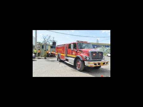 Members of the Jamaica Fire Brigade and the police cordoned a section of Kingston Wharves on Monday after a bomb threat.