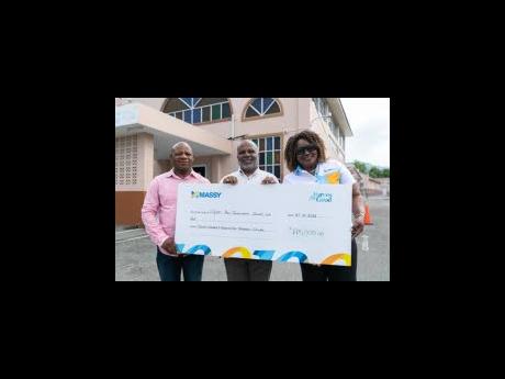From left: Property Manager of Clifton New Testament Church of God, Leon Thompson; Senior Pastor Reverend Munroe Wisdom Sr; and Customer Service and Logistics Manager at IGL Limited, Geneve Barnett-Fraser, pose with the ceremonial cheque for $775,000. 