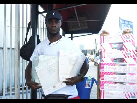 Credit: Kenyon Hemans Calder shows his academic qualifications.