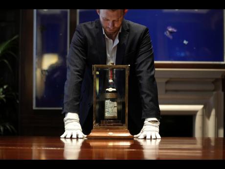 FILE - A view of a bottle of Macallan Adami 1926 whisky, on display during a media preview at Sotheby’s auction house, in London, England, on October 19, 2023. 