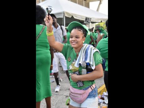 A Jamaica Labour Party supporter rings the freedom bell at the party’s 80th annual conference at the National Arena in St Andrew yesterday.