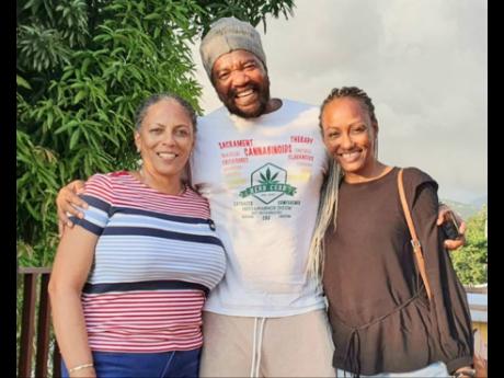 Schahaff (right) is a big lover of reggae so she was thrilled to meet reggae star Tony Rebel while on a recent visit to Jamaica. At left is Ardenne principal, Nadine Molloy.