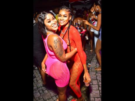  Zedaline (left) and Ashley share lens time during last weekend’s staging of Floss 360 Stringz pool party, held in Red Hills, St Andrew. 