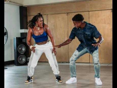 Kimiko shows Chad Luchey a few moves. 