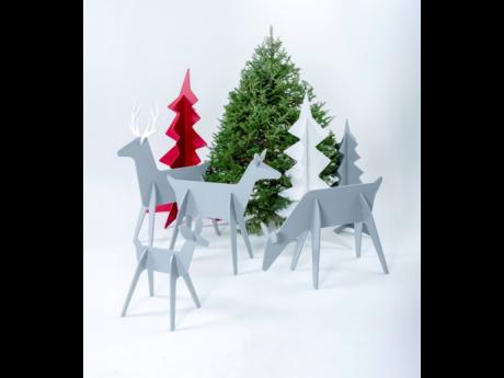This image, provided by Loll Designs, shows minimalist, contemporary wooden Christmas trees and reindeer.