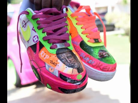 Credit: Ian Allen Here, Daley shows off her sneakers which pay tribute to her late dad, who inspired her auto creation.