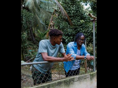 Chad Luchey (left) chats with farmer Cleo Jones, from Raise Right Poultry Farm.