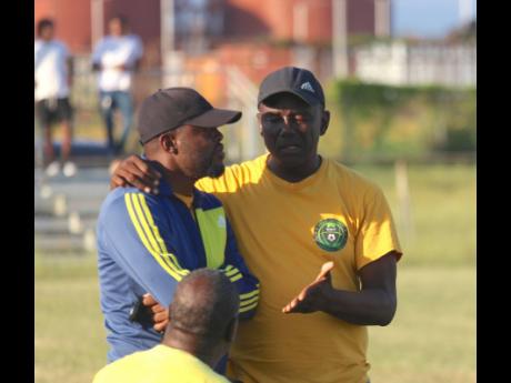 Vere United’s assistant coach Jermaine Douglas (left) chats with head coach Linval Dixon during their Jamaica Premier League game against Harbour View on Thursday at the Wembley Centre of Excellence.