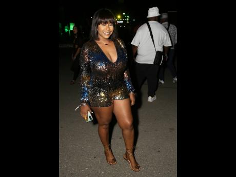 Francine Gordon sleekly paired her Bridget sandals with her multicoloured
sequin romper.