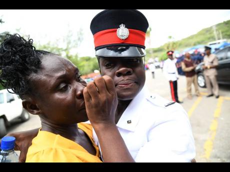 Woman constable Donique Anderson and her mother, Gem Donald.