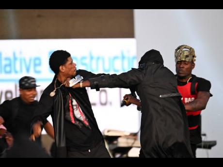 Credit: Ricardo Makyn Fully Bad (left) and Honormosity trade blows.