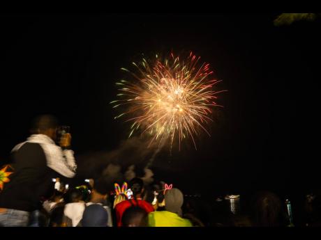 Patrons at the UDC Fireworks Festival capture the moment as they welcome 2024.