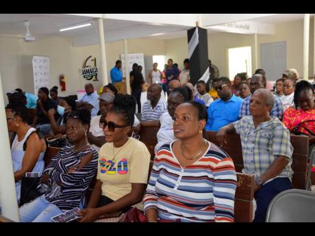 Persons in attendance during a recent Housing Agency of Jamaica title ceremony, which was held at the Hillview Baptist Church in St James.