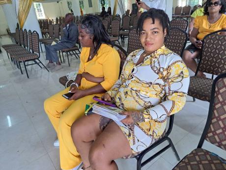 Krystal Lawrence and Dahlia Blackwood (left), daughter of the deceased, and Krystal Lawrence, at the funeral on Saturday.